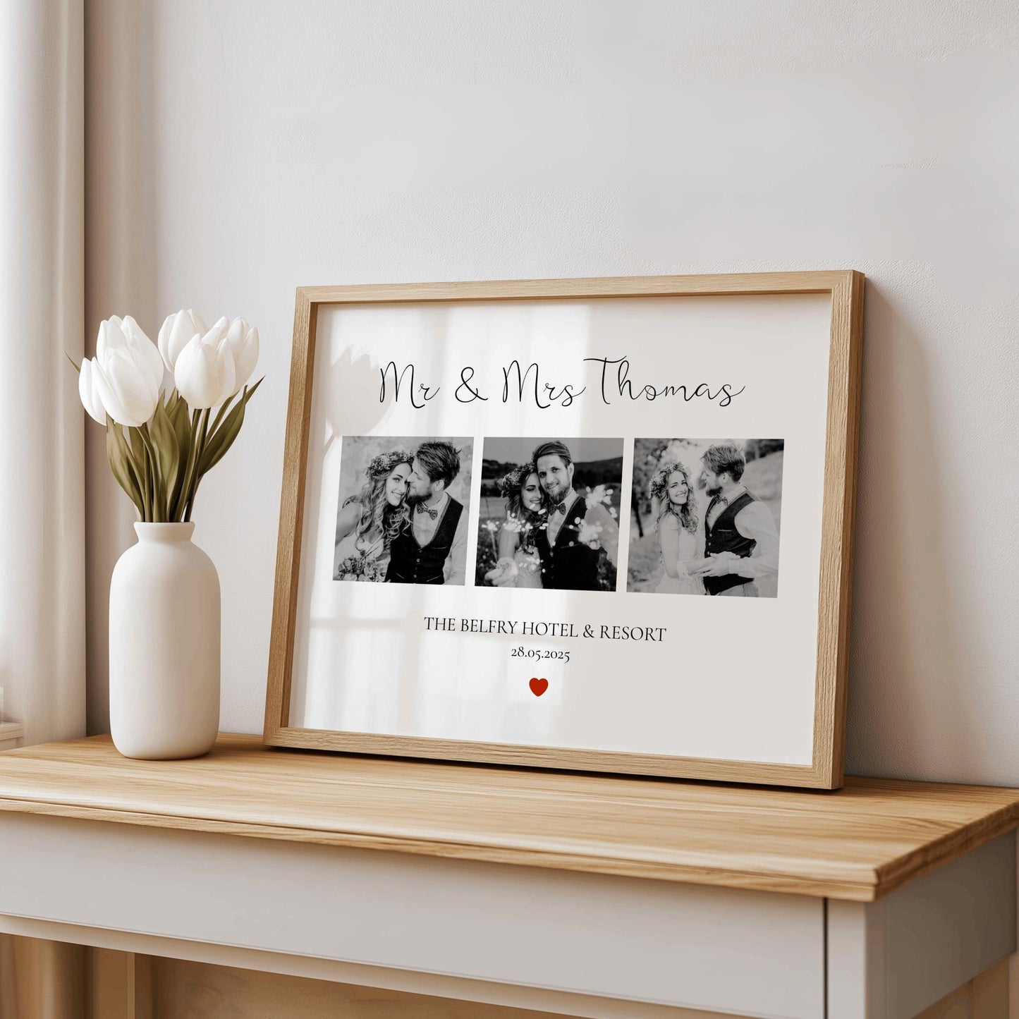 Framed photo collage with 'Mr & Mrs Thomas' text on a wooden surface with a vase of tulips.